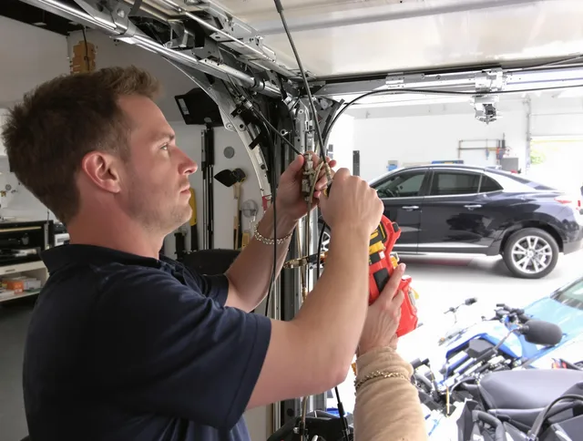 Granby Garage Door Repair safety certified technician performing cable replacement in Granby