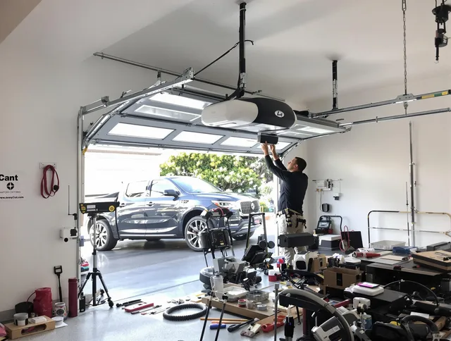 Granby Garage Door Repair specialist installing smart garage door opener system in Granby home