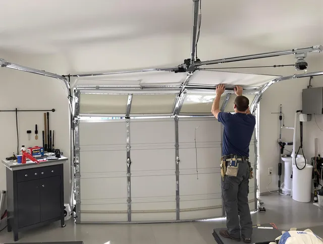 Granby Garage Door Repair specialist performing precise section replacement on Granby garage door