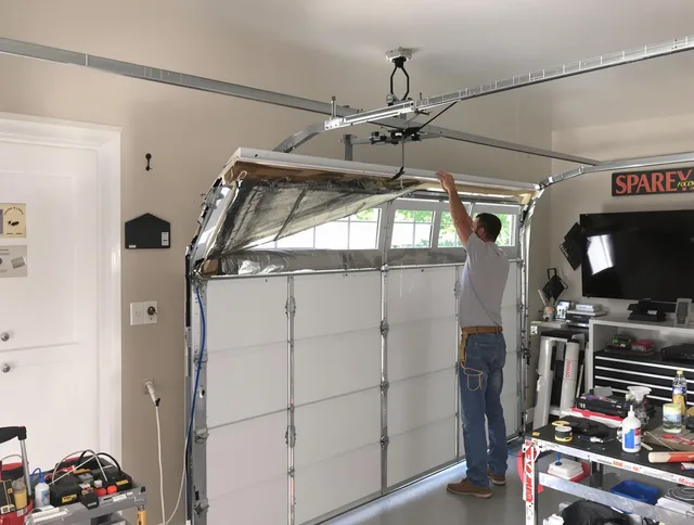 Garage door section replacement by Granby Garage Door Repair in Granby